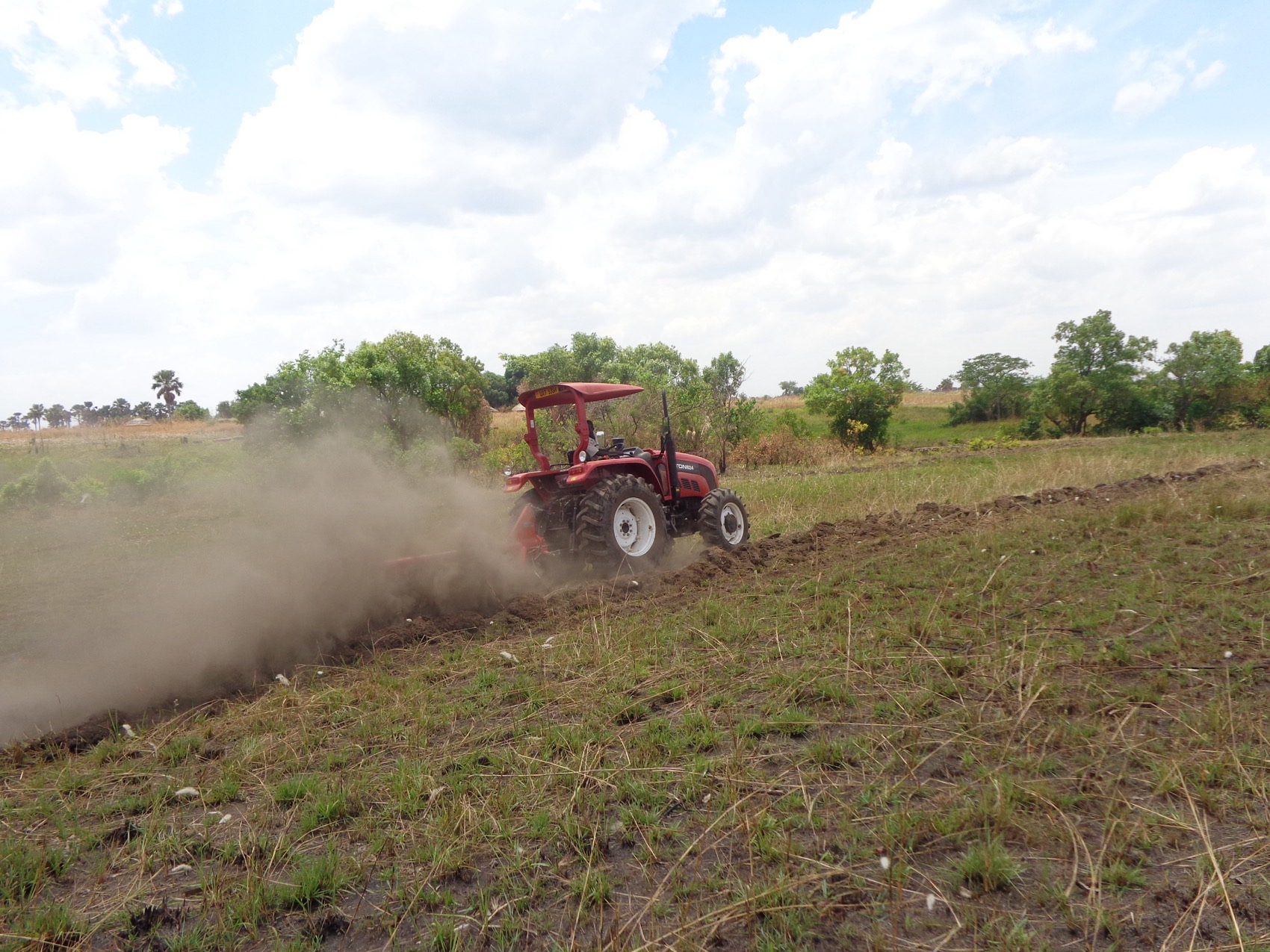 A tractor ploughing a farmers feild