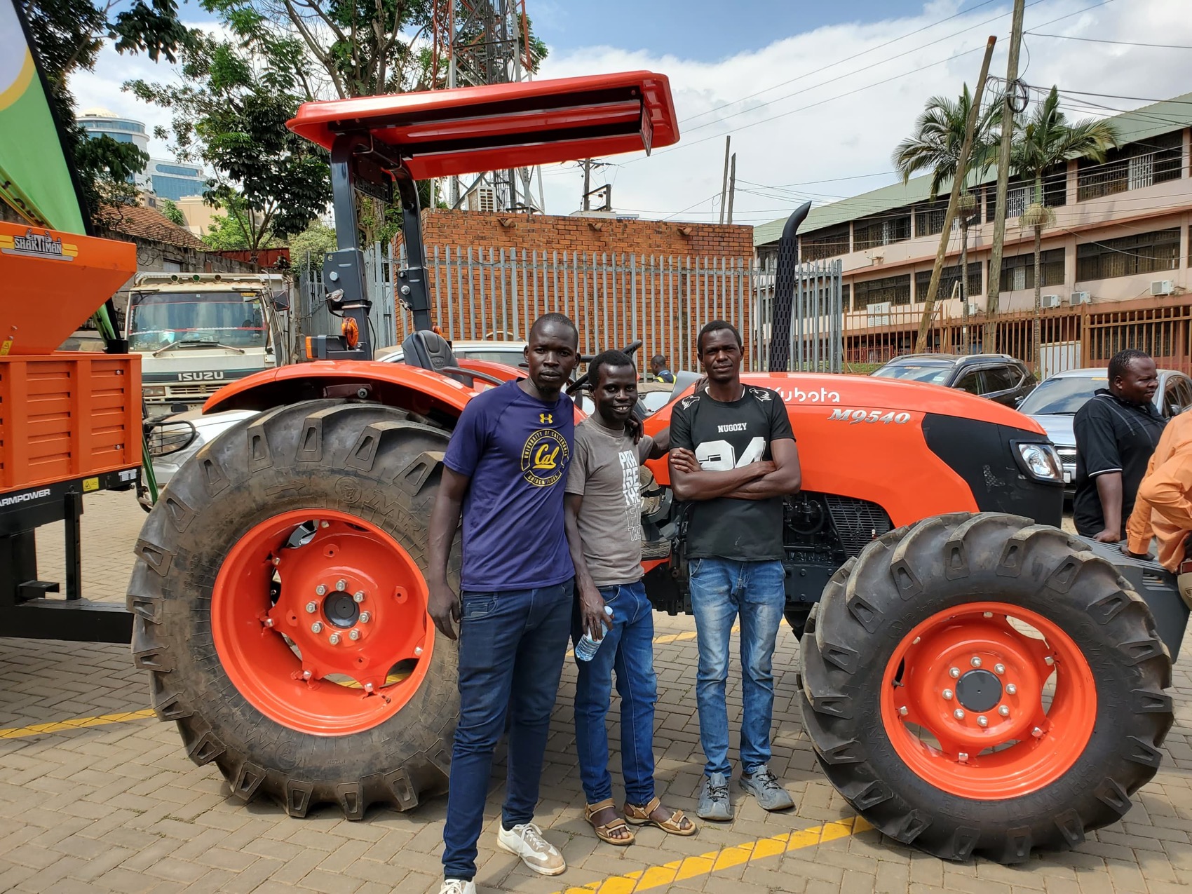 Members in front of a new Kubota tractor