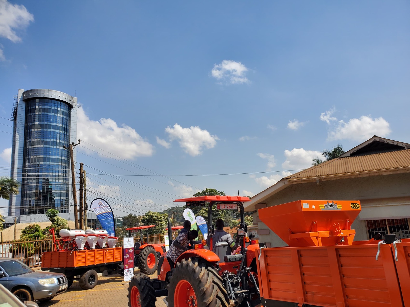 The new tractors and implements lined up at the handover